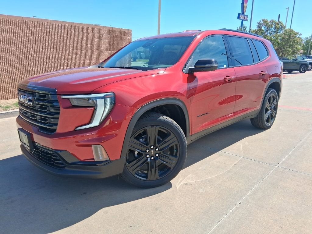 2026 GMC Acadia Elevation in Volcanic Red Tintcoat — front three-quarter view