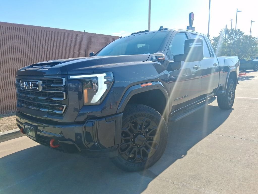 2026 GMC Sierra 2500 HD AT4 in Titanium Rush Metallic — front three-quarter view