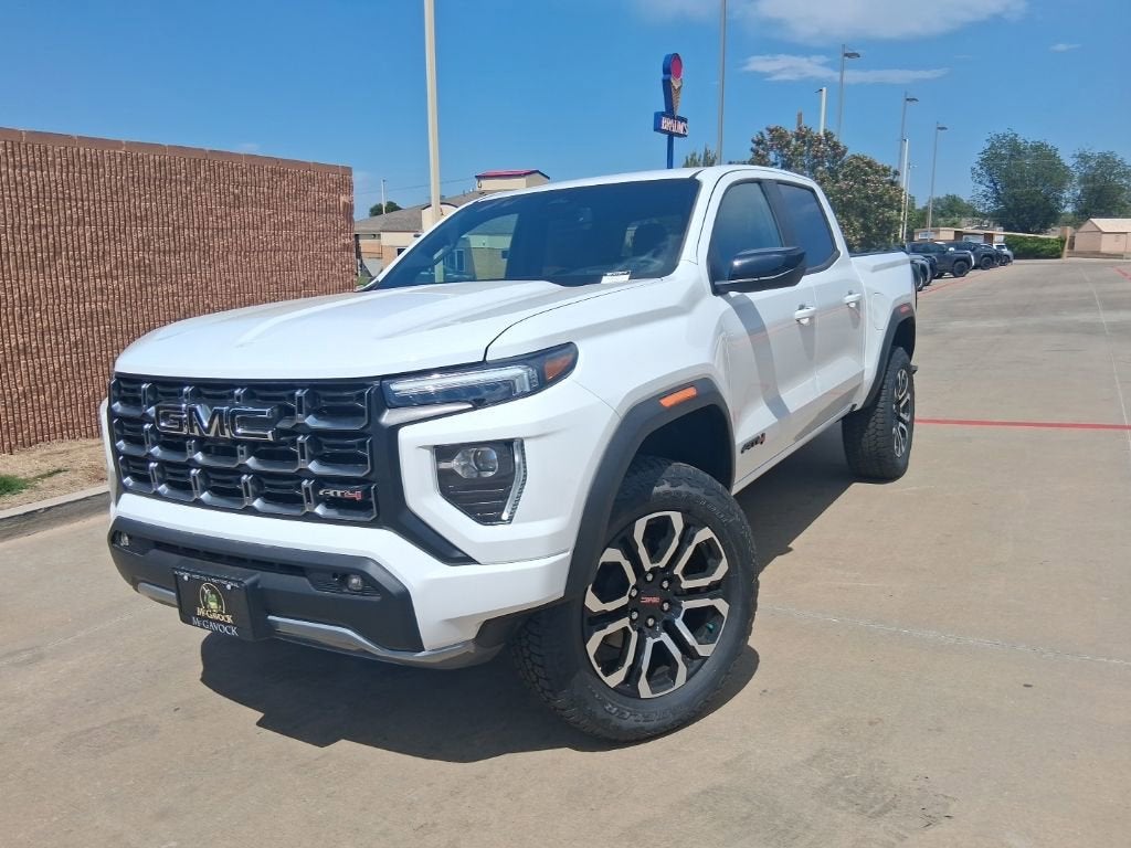 2026 GMC Canyon AT4 in Summit White — front three-quarter view