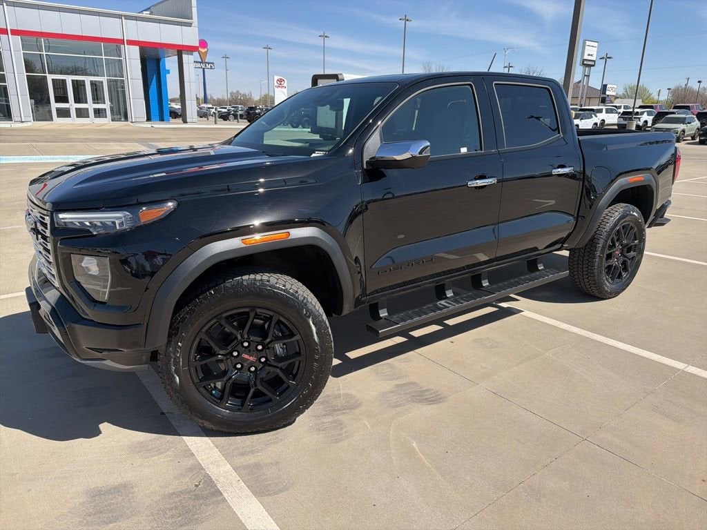 2026 GMC Canyon Denali in Onyx Black — front three-quarter view