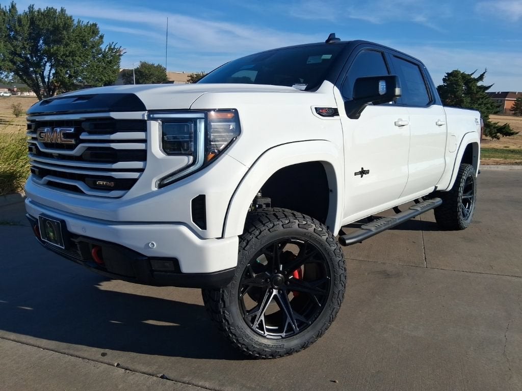 2026 GMC Sierra 1500 AT4 in Summit White — front three-quarter view